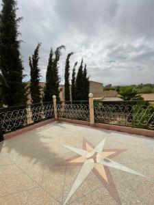 a star on the floor of a balcony at Villa HMR ⵥ in Rhorm el Alem +7 photos