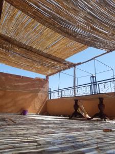 a balcony in a building with a wooden floor at MountainHouse- cozy and spacious family triplex in Midelt