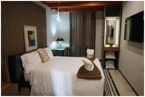 a hotel room with a bed with hats on it at Hotel Villa Nunziante Pompei in Scafati