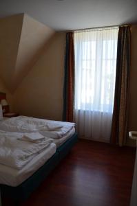 Postel nebo postele na pokoji v ubytování Loui´s FeWo Wiek