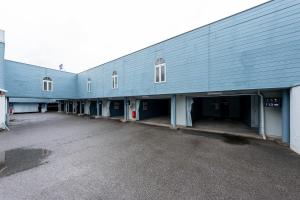 a large blue building with a large parking lot at Hotel Toiro -Adult Only- CHIBA in Chiba