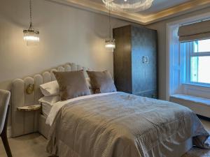 Una cama o camas en una habitación de Mj Apartment