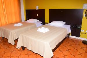 Ένα ή περισσότερα κρεβάτια σε δωμάτιο στο HOSTAL ELIAS tacna -peru