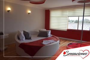 Postel nebo postele na pokoji v ubytování Motel Sensaciones + 4 fotografie