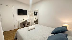 En eller flere senge i et værelse på Habitaciones Manuela