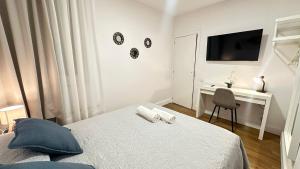 En eller flere senge i et værelse på Habitaciones Manuela