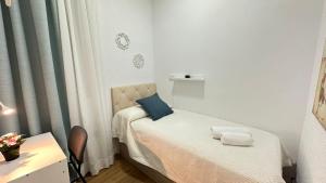 En eller flere senge i et værelse på Habitaciones Manuela