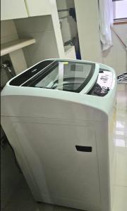 a machine with a cell phone on top of it at master bedroom in Medellín