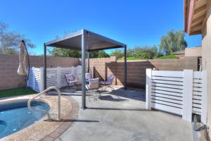 a patio with a canopy and a swimming pool at Private Mini Serene Oasis with Pool in Maricopa
