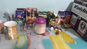 a table with two glasses and a bunch of snacks at استوديو بجوار طلعت حرب in Cairo