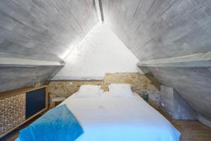 Ένα ή περισσότερα κρεβάτια σε δωμάτιο στο The Duplex - Domaine De L'ô