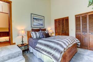 a bedroom with a large bed and a couch at 3 Spyglass in Sunriver
