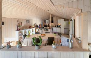 a large room with a table in a kitchen at Stunning Home In Tarm With Sauna in Højsand