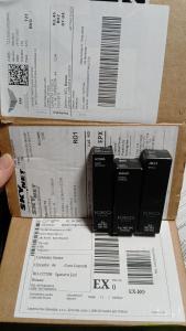 a box with four black books on top of it at Bros Apartment in Buzau