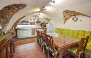 a kitchen and dining room with a table and chairs at 4 Bedroom Stunning Home In Montenero Val Cocchiar in Montenero Val Cocchiara