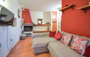 a living room with a couch with pillows on it at 4 Bedroom Stunning Home In Montenero Val Cocchiar in Montenero Val Cocchiara