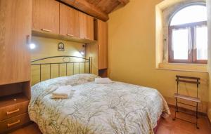 a bedroom with a bed with towels on it at 4 Bedroom Stunning Home In Montenero Val Cocchiar in Montenero Val Cocchiara