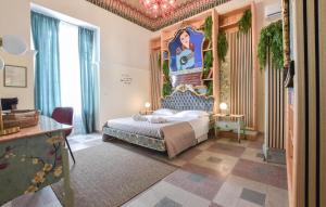 a bedroom with a king sized bed with a canopy at Le Stanze Letterarie in Cibali