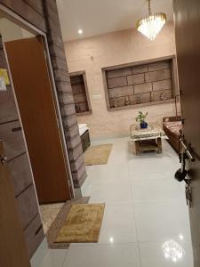 an open door to a living room with a table at Gopal Home Stay & Guest House in Jodhpur