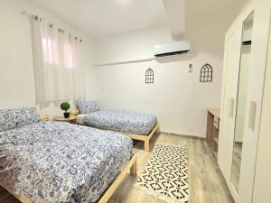 Ένα ή περισσότερα κρεβάτια σε δωμάτιο στο Olive Guest House