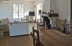 a living room with a couch and a fireplace at La Champêtre in Fayence