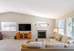 a living room with a couch and a fireplace at Quail On Sunset in Hood River