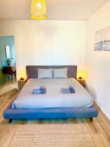 a bedroom with a large bed with two pillows on it at Cozy Apartment in Antwerp central in Antwerp