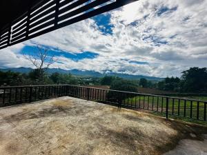a view from the back porch of a house at Pharit guesthouse in Pai