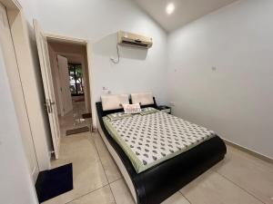 a small bedroom with a bed in a room at Sariska Bliss Farm, #2-BHK, #Private Pool & Garden in Alwar +40 photos