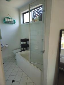 a bathroom with a shower and a tub and a toilet at Quiet, Peaceful Northcote Unit in Melbourne +7 photos