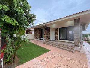 a house with a large tv on the side of it at Sariska Bliss Farm, #2-BHK, #Private Pool & Garden in Alwar