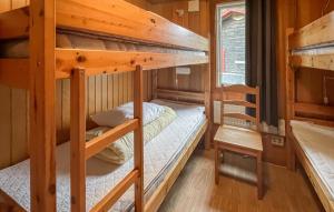 a couple of bunk beds in a tiny house at 1 Bedroom Lovely Home In Våxtorp in Jonstorp