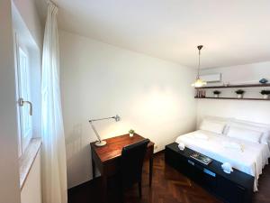 Postel nebo postele na pokoji v ubytování CORTILET