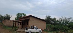 a white truck parked in front of a small house at Shivalika home stay in Maheshwar +7 photos