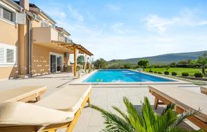 an image of a villa with a swimming pool at Villa Pleter by Villas Guide in Otavice