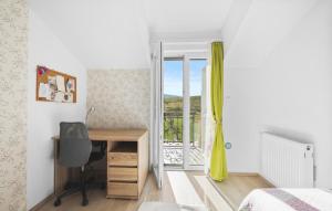 a bedroom with a desk and a bed and a window at Villa Pleter by Villas Guide in Otavice +64 photos