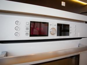 a microwave oven in a kitchen at Penthouse Studio with Terrace and City View - 5 mins walk to Hauptbahnhof Train Station in Vienna +16 photos