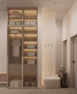 a room with a glass closet with a suitcase at Luxury Apartments BUDAPEST 2 in Uzhhorod