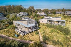 an aerial view of a house on a hill at Seaside Family Villa 6p - Direct bij het Strand - Villa 24 in Ouddorp