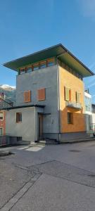 a large building with a door on the side of it at KOSIS Townhouse mit Spa Zugang im KOSIS Sports Lifestyle Hotel in Fügen