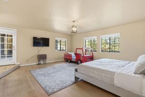 a bedroom with a bed and a toy truck in it at Spacious Mountain Getaway Game Room & Gazebo villa in Pine Mountain Club