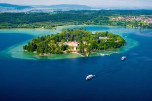 an island in the middle of a large body of water at Untersee Suite - Seenähe - Terrasse - Arbeitsplatz in Radolfzell am Bodensee