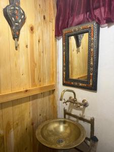 a bathroom with a sink and a mirror at Riad Deux Palmiers in Marrakech +25 photos