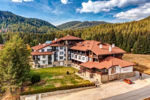 an aerial view of a large house in the mountains at Oak Residence Hotel & Relax in Smolyan