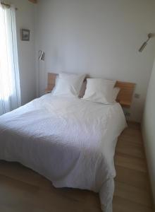 Postel nebo postele na pokoji v ubytování La Grange Du Vieux Village