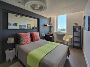a bedroom with a large bed and a mirror at La LUNA of MARSEILLE - VILLA D'ARCHITECTE B&B in Marseille +43 photos