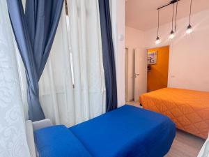 Un pat sau paturi într-o cameră la Affittacamere Miri +32 fotografii