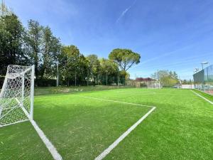 an empty soccer field with a net on it at 200mt Lake - Flower Home with Pool & Tennis in Peschiera del Garda