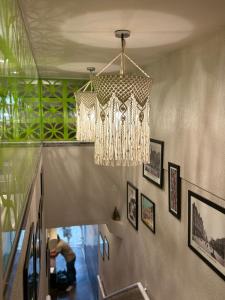 a chandelier hanging from the ceiling in a hallway at Downtown Santana Hotel in Rio de Janeiro