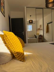 a bedroom with a bed with a ear of corn on it at Ti ponch in Mont-de-Marsan